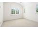 This bedroom features a neutral carpet and natural light from two windows at 852 Pontiac St, Denver, CO 80220