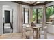 Breakfast nook with large windows, neutral drapes, and modern decor at 852 Pontiac St, Denver, CO 80220