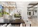 Open dining space with natural light and views of the living room and kitchen at 852 Pontiac St, Denver, CO 80220