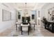 Formal dining room with modern chandelier and neutral decor at 852 Pontiac St, Denver, CO 80220