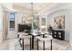 Dining room with fireplace, picture window, and seating for six at 852 Pontiac St, Denver, CO 80220
