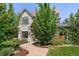 Charming stone home with manicured lawn and inviting walkway at 852 Pontiac St, Denver, CO 80220