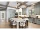 Spacious kitchen with a large center island, custom cabinetry, stainless steel appliances, and designer finishes at 852 Pontiac St, Denver, CO 80220