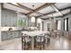 Open-concept kitchen featuring a large island, custom cabinets, stainless steel appliances, and ample counter space at 852 Pontiac St, Denver, CO 80220