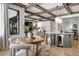 Open-concept kitchen and dining area with modern appliances and natural light at 852 Pontiac St, Denver, CO 80220