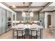 Gourmet kitchen featuring a large island, custom cabinets, modern appliances, and stylish pendant lighting at 852 Pontiac St, Denver, CO 80220