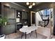 Sophisticated living room with dark built-ins, marble table, and view of the staircase at 852 Pontiac St, Denver, CO 80220