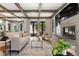 Bright and airy living room with modern fireplace, stylish furniture, and seamless access to the outdoor area at 852 Pontiac St, Denver, CO 80220