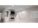 Bright living room featuring a stacked stone fireplace and built-in shelving at 852 Pontiac St, Denver, CO 80220