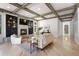Elegant living room with coffered ceilings, a modern fireplace, hardwood floors, and stylish decor at 852 Pontiac St, Denver, CO 80220