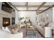 Inviting living room with a modern fireplace, coffered ceilings, and comfortable seating for relaxation and entertaining at 852 Pontiac St, Denver, CO 80220