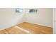This room features a window, light-colored hardwood floors, and white walls at 6155 Carr St, Arvada, CO 80004