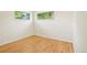 This room features a window, light-colored hardwood floors, and white walls at 6155 Carr St, Arvada, CO 80004