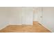This bedroom features wood floors, closet space, and an open door into the hallway at 6155 Carr St, Arvada, CO 80004