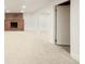 Spacious living room with fireplace and carpet flooring at 6155 Carr St, Arvada, CO 80004