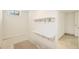 Unfinished storage room with built in shelves and a rug at 6155 Carr St, Arvada, CO 80004
