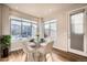 Charming dining area featuring a glass table and white chairs at 6861 Clay St, Denver, CO 80221