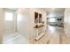 Bright entryway with light wood floors and a console table at 47387 Lilac Ave, Bennett, CO 80102