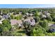 Aerial view of the neighborhood showcasing the mature trees and landscaping at 1010 Home Farm Cir, Denver, CO 80234