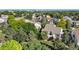 Aerial view of the home showcasing mature trees and landscaping at 1010 Home Farm Cir, Denver, CO 80234