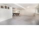 Spacious basement area with a billiard table, neutral carpet and white walls, offering potential for entertainment at 1010 Home Farm Cir, Denver, CO 80234