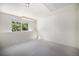 Versatile basement with a bright window and neutral carpet, ready to be transformed into your dream space at 1010 Home Farm Cir, Denver, CO 80234