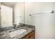 Bathroom features granite countertops and a modern sink at 1010 Home Farm Cir, Denver, CO 80234