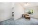 Bedroom featuring a sitting area, large window, and carpeted floors at 1010 Home Farm Cir, Denver, CO 80234