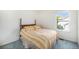 Cozy bedroom with a wooden headboard bed and natural light from the window at 1010 Home Farm Cir, Denver, CO 80234