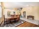 Spacious dining area with stairs to second floor and access to kitchen and living area at 1010 Home Farm Cir, Denver, CO 80234