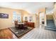 Formal dining room with hardwood flooring, neutral paint colors, and plenty of natural light at 1010 Home Farm Cir, Denver, CO 80234