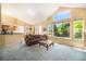 Bright living room offers an open layout with large windows and neutral carpeting at 1010 Home Farm Cir, Denver, CO 80234