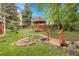 Picturesque backyard featuring a gazebo, small bridge and serene water feature at 1160 Johnson St, Lakewood, CO 80215