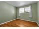 Cozy bedroom with hardwood floors, soft lighting and a serene atmosphere at 1160 Johnson St, Lakewood, CO 80215