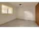 White walled bedroom with carpeted flooring and a window, featuring a plain yet functional design at 1160 Johnson St, Lakewood, CO 80215