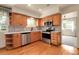 Updated kitchen featuring stainless steel appliances, hardwood floors and ample cabinet space at 1160 Johnson St, Lakewood, CO 80215