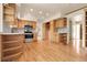 Open-concept kitchen with stainless steel appliances, hardwood floors and plenty of storage space at 1160 Johnson St, Lakewood, CO 80215