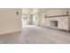 Bright living room with large windows, elegant lighting and a stylish fireplace at 1160 Johnson St, Lakewood, CO 80215