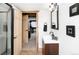 Bathroom showcasing a wood-framed doorway and a shower with black hardware at 9034 Us Highway 285, Morrison, CO 80465