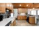 Bright kitchen with a farmhouse sink, stainless steel appliances, and custom backsplash at 9034 Us Highway 285, Morrison, CO 80465