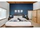 Beautiful main bedroom with wood accents and stylish decor at 9034 Us Highway 285, Morrison, CO 80465