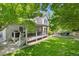 Spacious backyard with deck, patio, and lush lawn at 4686 Longs Ct, Broomfield, CO 80023