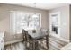 Cozy dining area with table and chairs, overlooking a snowy backyard at 4686 Longs Ct, Broomfield, CO 80023