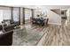 Open concept dining area with hardwood floors and modern chandelier at 4686 Longs Ct, Broomfield, CO 80023