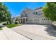 Two-story house with a three-car garage and manicured lawn at 4686 Longs Ct, Broomfield, CO 80023