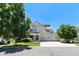 Two-story house with a three-car garage and green lawn at 4686 Longs Ct, Broomfield, CO 80023