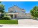 Two-story house with a three-car garage and landscaped lawn at 4686 Longs Ct, Broomfield, CO 80023