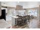 Spacious kitchen featuring white cabinets, granite countertops, and a large island at 4686 Longs Ct, Broomfield, CO 80023