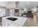 Open floor plan showing kitchen island and adjacent living room at 4686 Longs Ct, Broomfield, CO 80023