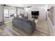 Relaxing living room with gray sectional sofa and large windows at 4686 Longs Ct, Broomfield, CO 80023